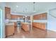 Open-concept kitchen boasts stainless steel appliances, an island, and ample cabinet space at 531 Crossland Dr, Moncks Corner, SC 29461
