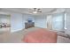 Large main bedroom with neutral carpet, tray ceiling, and access to ensuite bathroom at 531 Crossland Dr, Moncks Corner, SC 29461