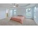 Bright main bedroom offers ample windows, tray ceiling, and comfortable space at 531 Crossland Dr, Moncks Corner, SC 29461