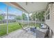Screened patio area with furniture and hammock overlooking the backyard and neighborhood at 531 Crossland Dr, Moncks Corner, SC 29461