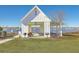 Waterfront outdoor pavilion with picnic tables and grilling area, offering scenic views of the lake at 531 Crossland Dr, Moncks Corner, SC 29461