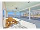Spacious open-air pavilion featuring multiple picnic tables, ceiling fans, and views of the lake at 531 Crossland Dr, Moncks Corner, SC 29461