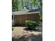 Landscaped backyard featuring a stylish privacy screen and mature bushes at 5423 Buckeye Rd, Hollywood, SC 29449