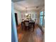 Traditional dining room with hardwood floors, dark wood table, chandelier, and tasteful decorations at 5423 Buckeye Rd, Hollywood, SC 29449