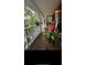 Inviting front porch with rocking chairs, plants, and charming decor at 5423 Buckeye Rd, Hollywood, SC 29449