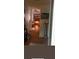 Inviting hallway view into the living room with a warm fireplace at 5423 Buckeye Rd, Hollywood, SC 29449