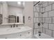 Updated bathroom with white vanity and shower featuring black and white tile at 62 Wexford Way, Walterboro, SC 29488