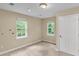 Bright bedroom featuring two windows and neutral walls at 62 Wexford Way, Walterboro, SC 29488