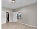 Neutral bedroom with wood floors looking into a walk-in closet and the kitchen at 62 Wexford Way, Walterboro, SC 29488