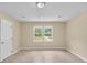 This bedroom features natural light with neutral walls and updated floors at 62 Wexford Way, Walterboro, SC 29488