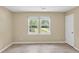 Bright bedroom featuring natural light with updated floors and neutral walls at 62 Wexford Way, Walterboro, SC 29488