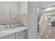 Bright laundry room with a new white washer and dryer next to entry foyer and stairs at 62 Wexford Way, Walterboro, SC 29488