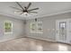 Bright living room with fresh paint, wood floors, and modern ceiling fan, featuring a decorative glass door at 62 Wexford Way, Walterboro, SC 29488