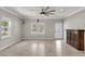 Open-concept living room featuring wood floors, recessed lighting, neutral paint, and large windows at 62 Wexford Way, Walterboro, SC 29488