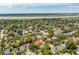 Expansive aerial view of a residential neighborhood nestled amidst lush trees and waterways at 66 Darlington Ave, Charleston, SC 29403