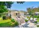 Inviting backyard with a spacious deck, lush greenery, and ample seating at 66 Darlington Ave, Charleston, SC 29403