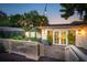 Cozy backyard patio with string lights, a deck, and an outdoor seating area at 66 Darlington Ave, Charleston, SC 29403