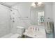 Bathroom featuring a shower with gray tile and a modern faucet and hardware at 66 Darlington Ave, Charleston, SC 29403