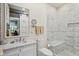 Elegant bathroom with marble, sleek fixtures, and modern glass shower at 66 Darlington Ave, Charleston, SC 29403