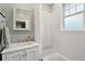 Classic bathroom with white subway tile, a marble-top vanity, and a shower-tub combo at 66 Darlington Ave, Charleston, SC 29403
