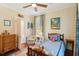 Cozy bedroom with hardwood floors, a ceiling fan, and ample natural light at 66 Darlington Ave, Charleston, SC 29403