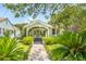 Charming cottage-style home with a landscaped front yard and a cozy, inviting entrance at 66 Darlington Ave, Charleston, SC 29403