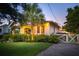 Quaint home at twilight, featuring a lush garden and welcoming curb appeal at 66 Darlington Ave, Charleston, SC 29403