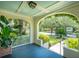 Inviting front porch with a view of the beautifully landscaped street and surrounding neighborhood at 66 Darlington Ave, Charleston, SC 29403