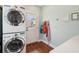 Efficient laundry room with a stacked washer and dryer and ample counter space at 66 Darlington Ave, Charleston, SC 29403