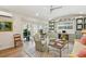 Bright living space with light-colored walls, hardwood floors, built-in shelving, and sliding glass doors at 66 Darlington Ave, Charleston, SC 29403