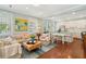 Bright living room with an open floor plan, seamlessly connecting to the dining area and kitchen at 66 Darlington Ave, Charleston, SC 29403