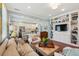 Spacious living area with built-in shelving, hardwood floors, and an open layout flowing into the kitchen at 66 Darlington Ave, Charleston, SC 29403