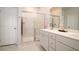 Modern bathroom with a double sink vanity, a glass-enclosed shower, and marble-like tiles at 6972 Pumpkinseed Dr, Johns Island, SC 29455