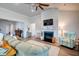 Bright living room features a fireplace, ceiling fan, and plenty of natural light at 6972 Pumpkinseed Dr, Johns Island, SC 29455