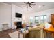 Spacious living room with a fireplace, ceiling fan, and open layout for entertaining at 6972 Pumpkinseed Dr, Johns Island, SC 29455