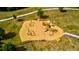 Aerial view of the community playground with swings, slides, and ample seating in the picnic tables at 6972 Pumpkinseed Dr, Johns Island, SC 29455