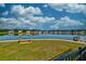 A large neighborhood pond surrounded by homes in a suburban setting at 6972 Pumpkinseed Dr, Johns Island, SC 29455