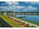 Dock extending into a scenic pond surrounded by a residential community at 6972 Pumpkinseed Dr, Johns Island, SC 29455