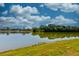 Scenic view of a tranquil pond reflecting the surrounding trees and homes in the community at 6972 Pumpkinseed Dr, Johns Island, SC 29455