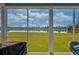 Enjoy picturesque lake views from the screened-in porch, perfect for relaxation at 6972 Pumpkinseed Dr, Johns Island, SC 29455