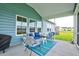 Cozy screened-in porch with comfortable seating, perfect for enjoying the outdoors at 6972 Pumpkinseed Dr, Johns Island, SC 29455