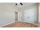 This bedroom offers hardwood floors and a view to the adjacent room at 709 Oakridge View Trl, Ridgeville, SC 29472