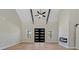 Bright living room with high ceilings, fireplace, and contemporary ceiling fan at 709 Oakridge View Trl, Ridgeville, SC 29472