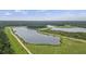 Scenic aerial view of a serene lake and recreational area, showcasing the natural beauty of the park at 7879 Gull Bay Dr, Awendaw, SC 29429
