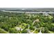 Lushly landscaped property with mature trees; an expansive aerial view near the waterfront at 7879 Gull Bay Dr, Awendaw, SC 29429