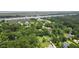 Expansive aerial view of lushly landscaped property with mature trees near the waterfront at 7879 Gull Bay Dr, Awendaw, SC 29429