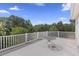 Balcony offers picturesque treetop views and an ideal space for outdoor relaxation at 7879 Gull Bay Dr, Awendaw, SC 29429