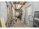 Basement storage with tools, garden supplies, and utility access at 7879 Gull Bay Dr, Awendaw, SC 29429