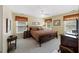 Comfortable bedroom featuring a ceiling fan, and natural light from the multiple windows at 7879 Gull Bay Dr, Awendaw, SC 29429