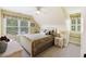 Cozy bedroom with natural lighting, and neutral tones with decorative accents and a seating area at 7879 Gull Bay Dr, Awendaw, SC 29429